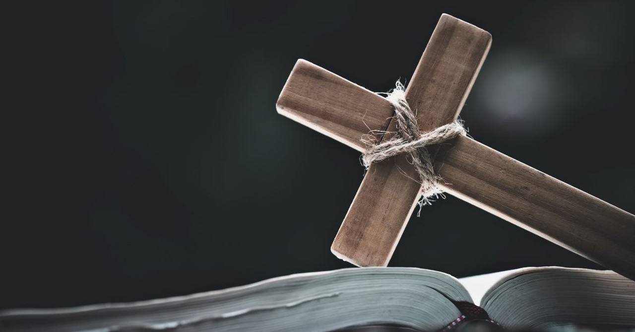 A cross lying on a Bible
