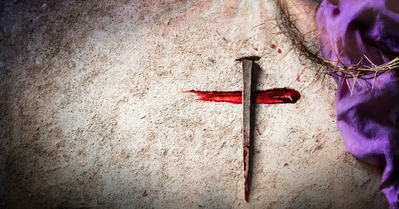 Cross made by a nail and streak of blood