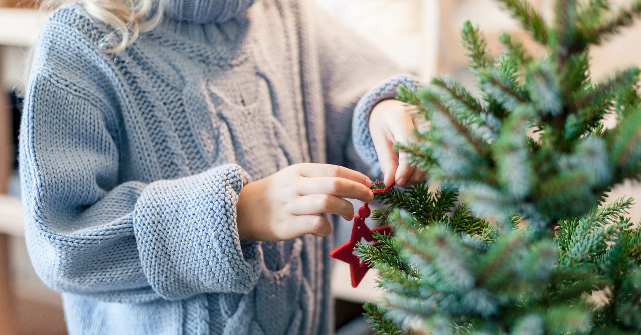 Woman decorating her Christmas tree