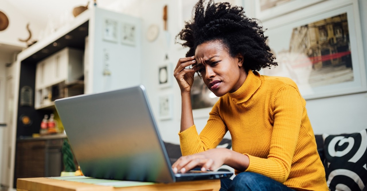 Woman upset angry frustrated at laptop working